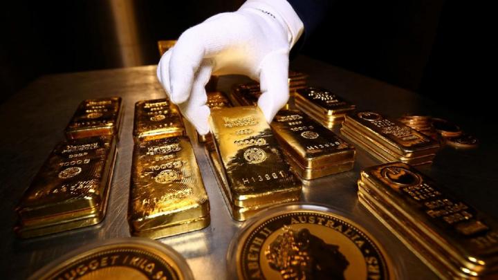 Gold prices rebound after briefly sinking below $1700